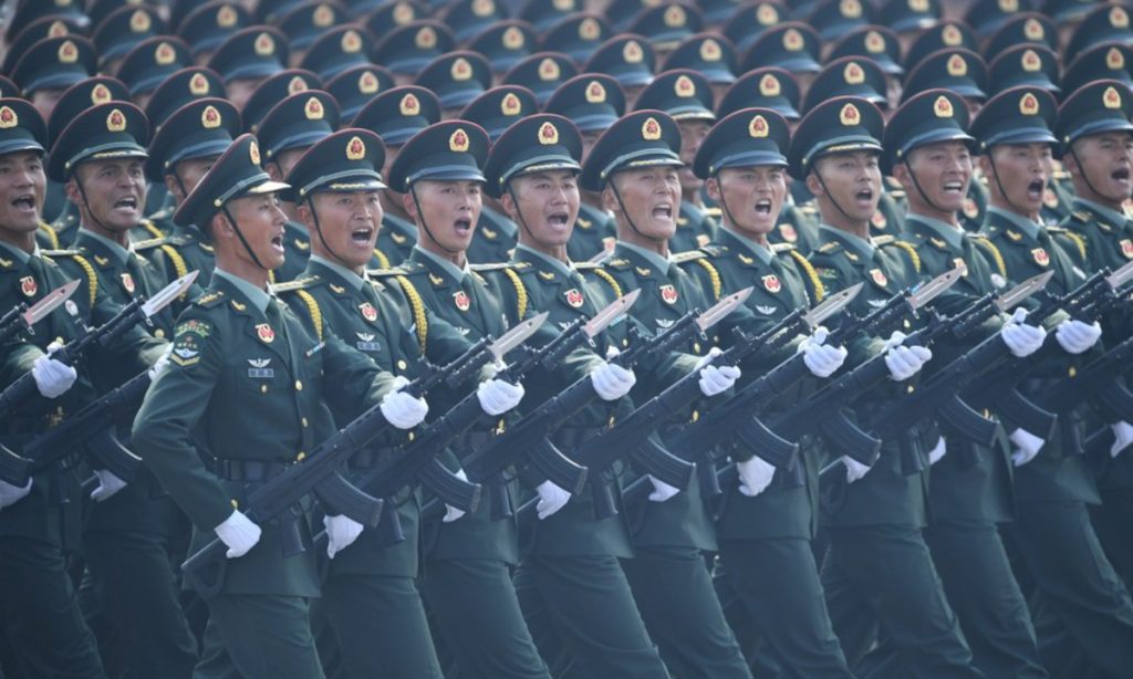 A formation of the People's Liberation Army (PLA) takes part in a military parade in Beijing. 